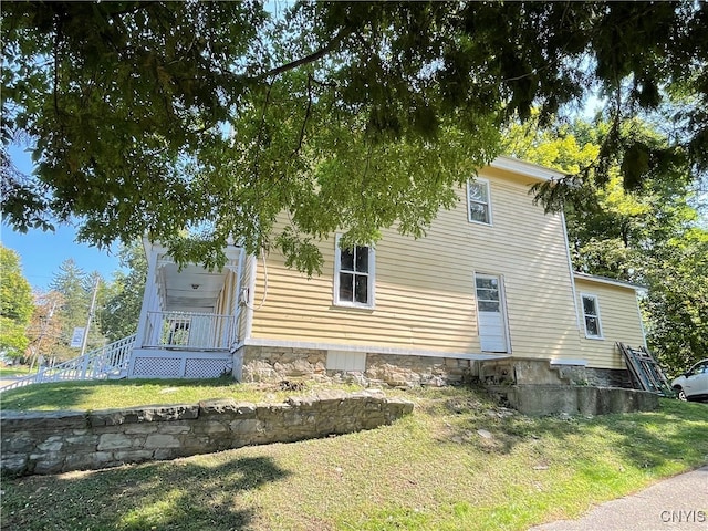 view of home's exterior featuring a lawn