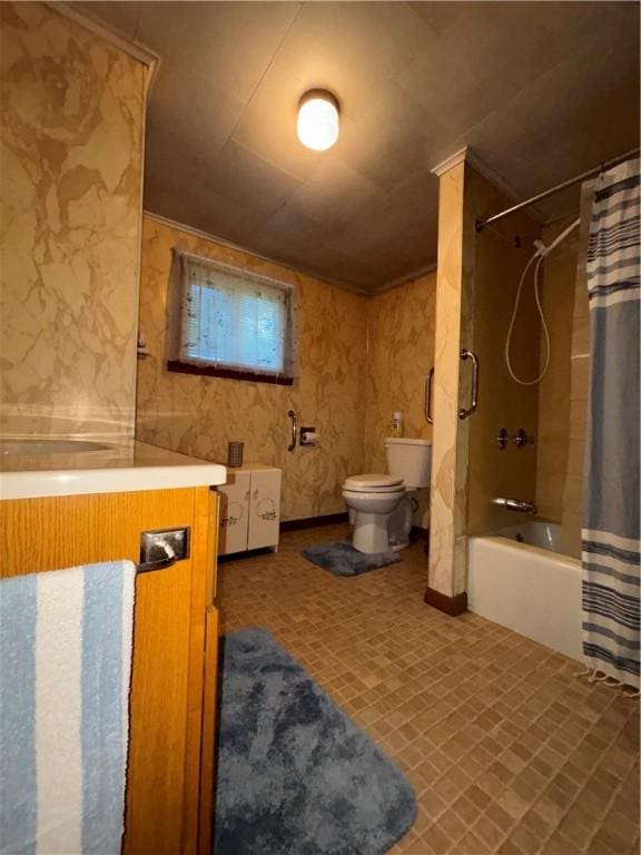bathroom with shower / bathtub combination with curtain, toilet, and vanity