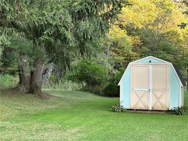 view of outbuilding featuring a lawn