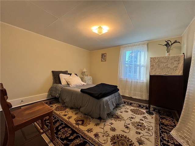 bedroom with crown molding