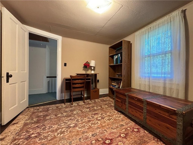 office area with a textured ceiling
