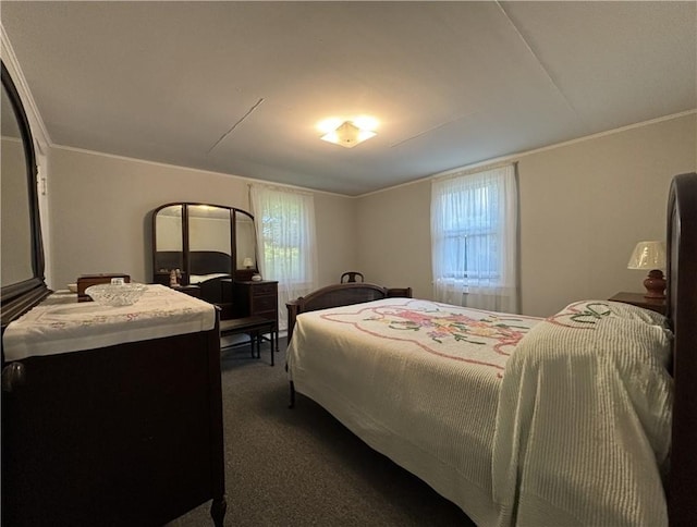 bedroom featuring ornamental molding and dark colored carpet