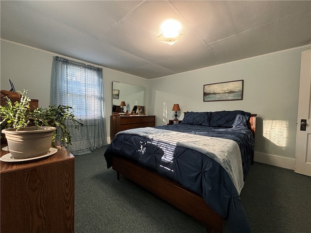 carpeted bedroom with ornamental molding