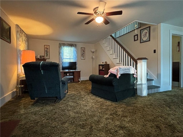 carpeted living area featuring a ceiling fan, baseboards, and stairway