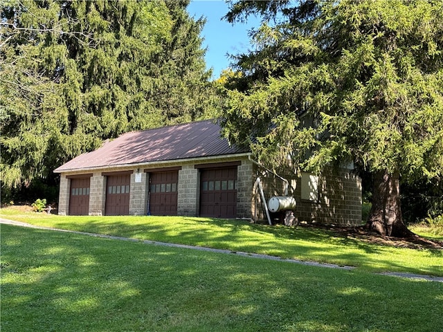 garage with a lawn