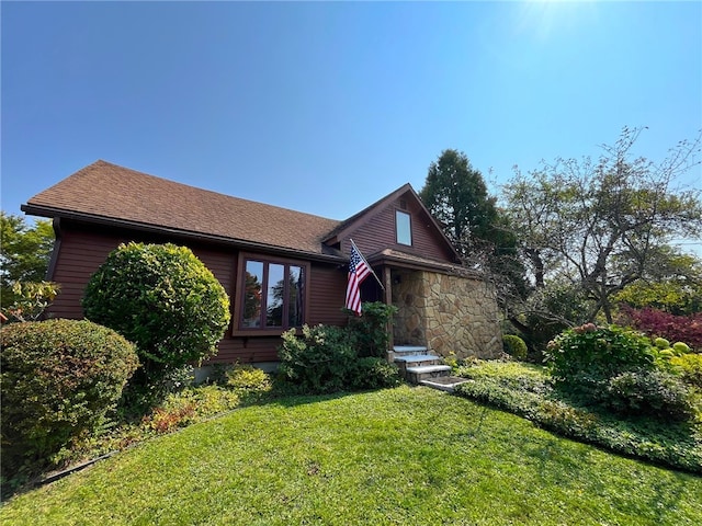 view of front of home with a front lawn