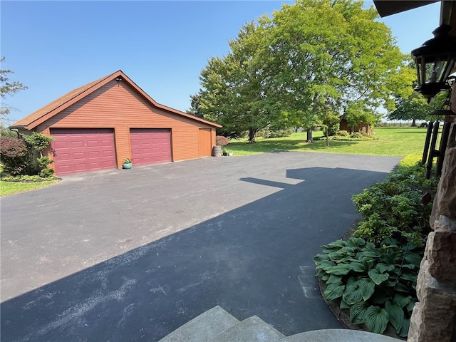 garage with a yard