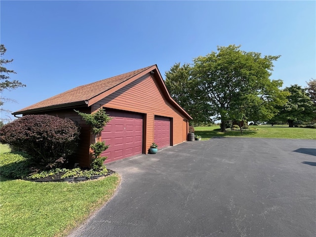 garage with a yard