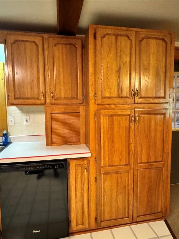 kitchen with dishwasher and decorative backsplash