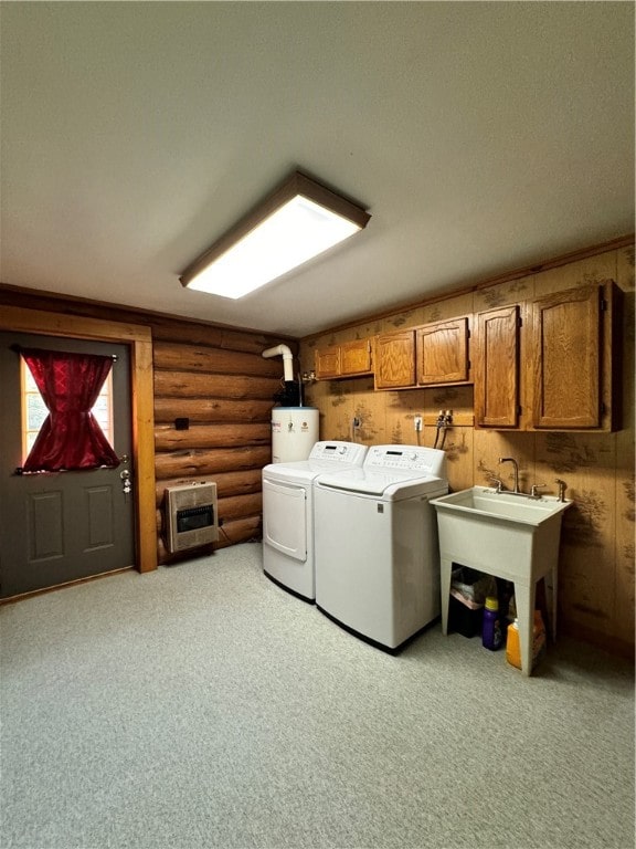 washroom featuring heating unit, water heater, cabinets, independent washer and dryer, and log walls