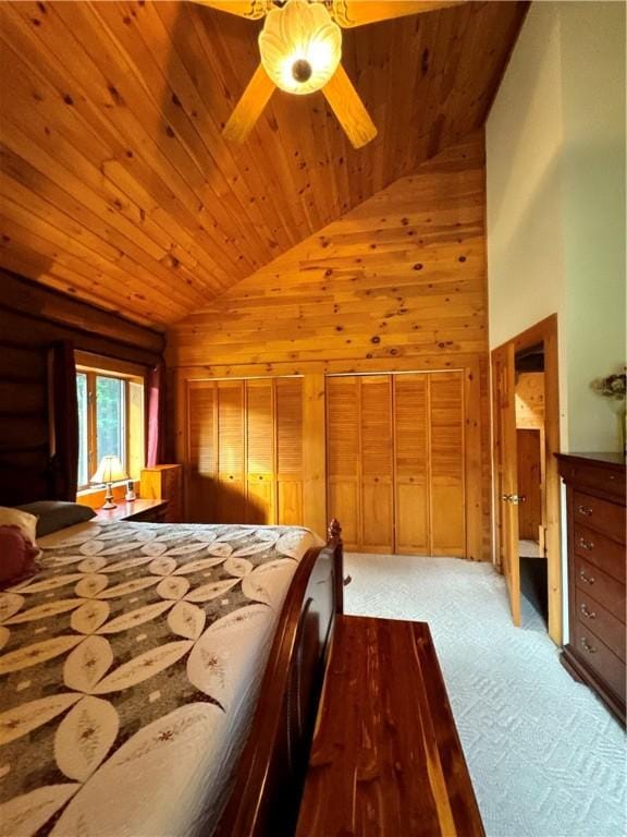 bedroom with light carpet, wooden ceiling, high vaulted ceiling, and wood walls