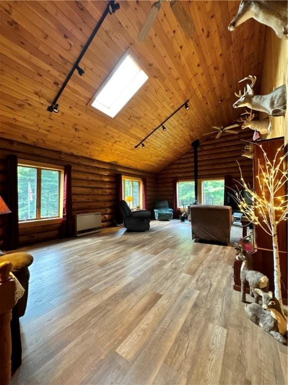 bonus room with high vaulted ceiling, a skylight, wood-type flooring, log walls, and wood ceiling