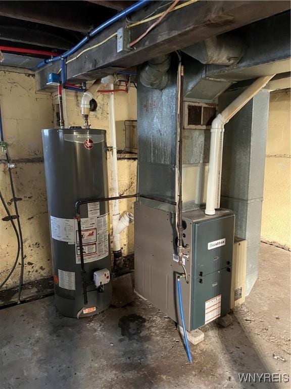 utility room featuring heating unit and water heater