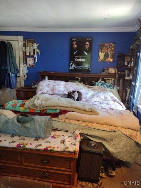 bedroom featuring ornamental molding