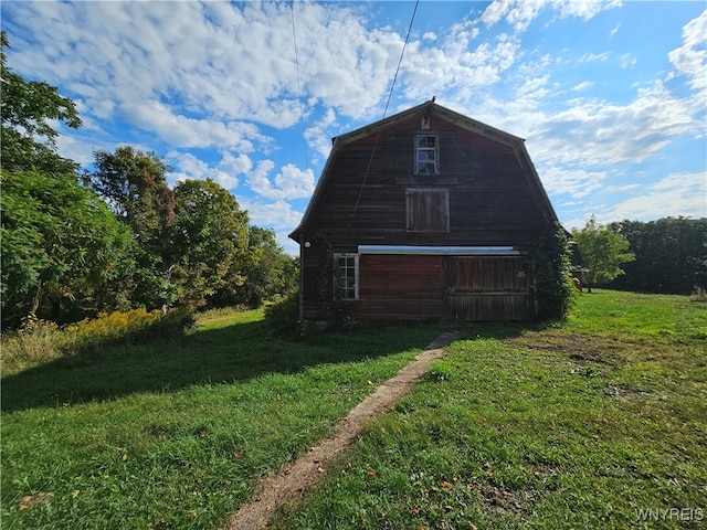 garage featuring a lawn