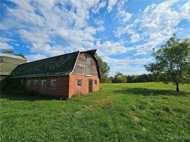 view of property exterior featuring a lawn