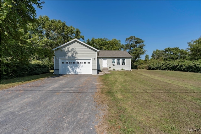 view of front facade featuring a garage and a front lawn