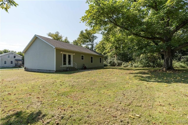 view of yard featuring french doors