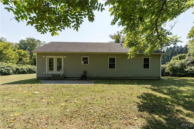 back of house with a yard