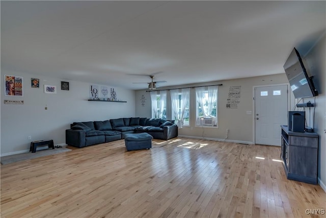 living room featuring ceiling fan and light wood-type flooring