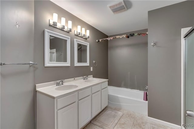 bathroom featuring tile patterned flooring and vanity