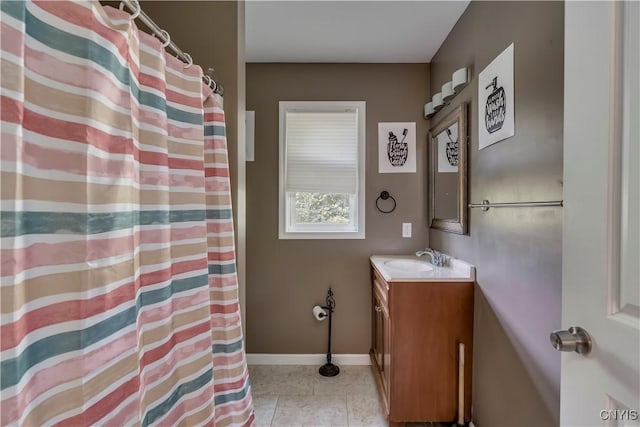 bathroom featuring tile patterned flooring and vanity