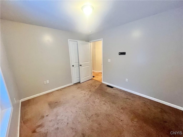 unfurnished bedroom with carpet flooring