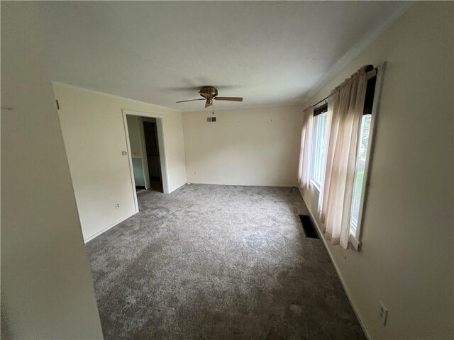 carpeted empty room with ceiling fan