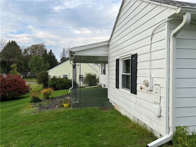 view of side of property with a yard