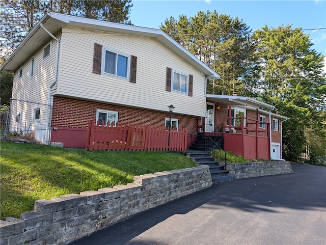 view of front of property featuring a garage and a front yard