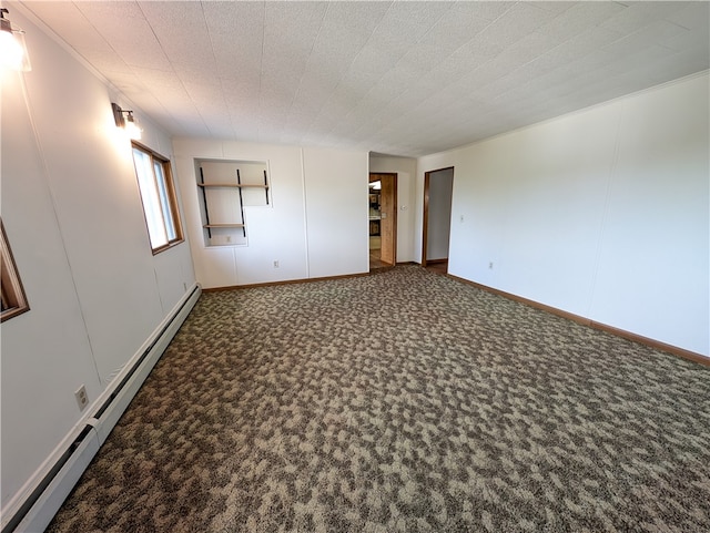 carpeted empty room featuring a baseboard radiator and a textured ceiling