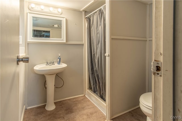 bathroom with walk in shower and toilet