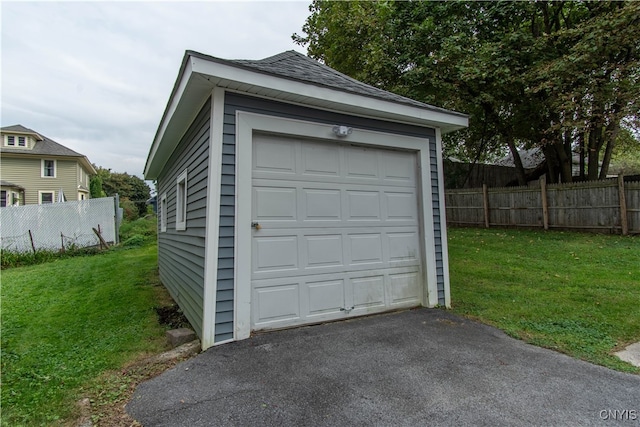 garage with a yard