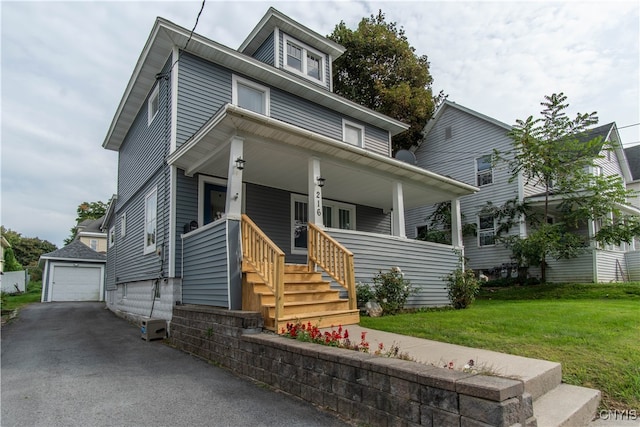 view of front facade featuring an outdoor structure, a front yard, a porch, and a garage