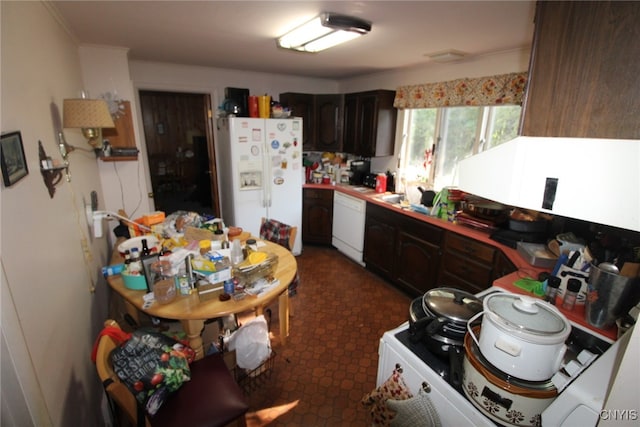 kitchen featuring white appliances and dark brown cabinets