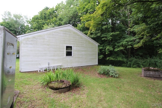 view of home's exterior with a yard