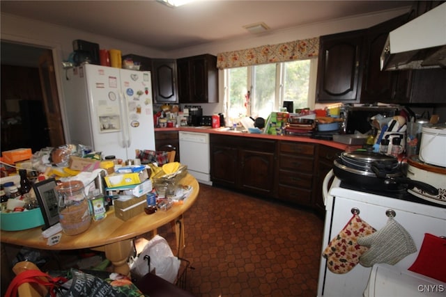 kitchen featuring dark brown cabinets, white appliances, and range hood