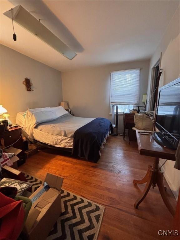 bedroom with wood finished floors