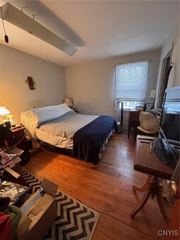 bedroom with wood finished floors