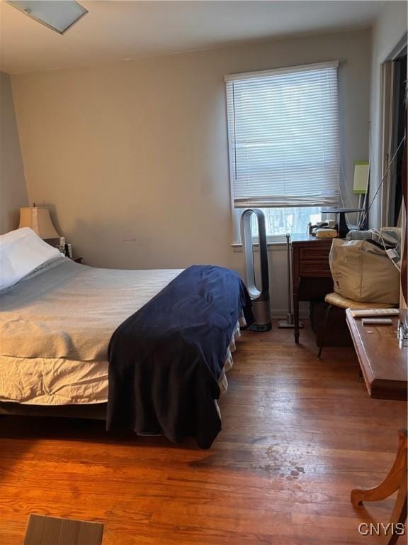 bedroom featuring wood finished floors