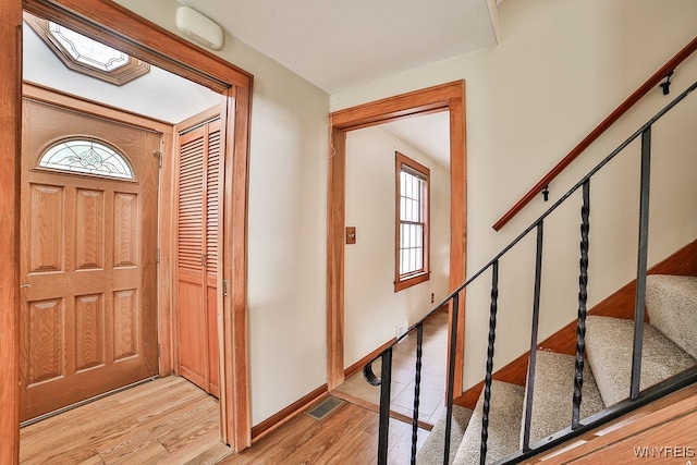 foyer featuring light hardwood / wood-style floors and a healthy amount of sunlight