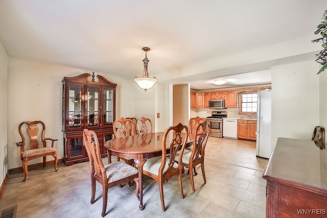 dining space featuring sink