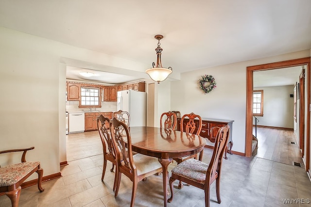 dining area featuring light wood-type flooring