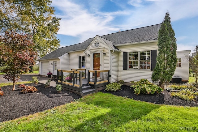 single story home with a wooden deck and a front lawn