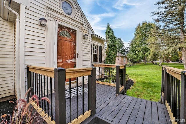 wooden deck with a lawn