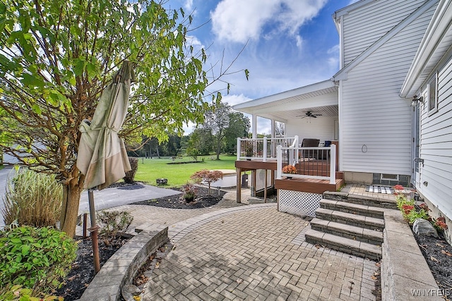 view of patio featuring ceiling fan