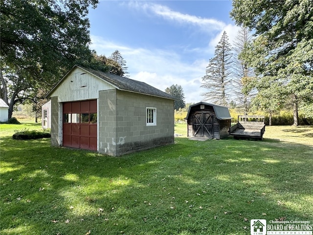 view of outbuilding with a lawn