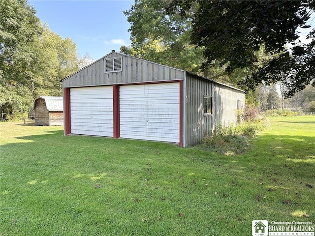 garage with a yard