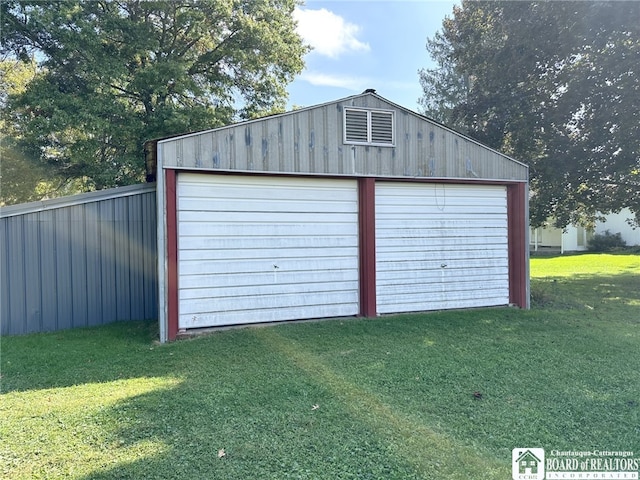 garage with a lawn