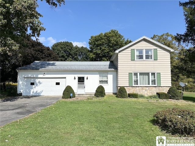 front of property featuring a garage and a front lawn